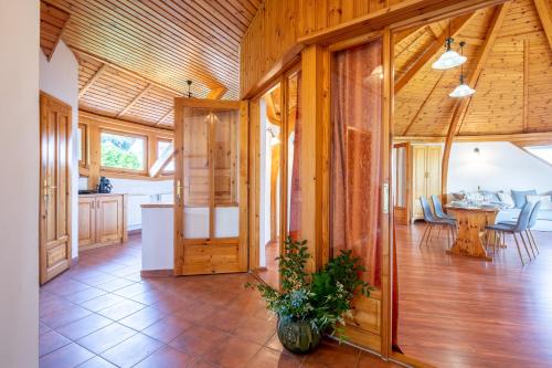 a kitchen and dining room in a wooden house at KupolaVilla-Apartment-Event house by the Danube river-Buda in Budapest
