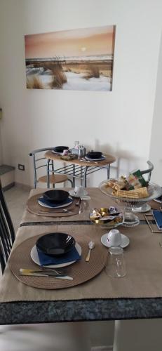 a table with plates of food on top of it at La Rosa del Salento in San Cesario di Lecce