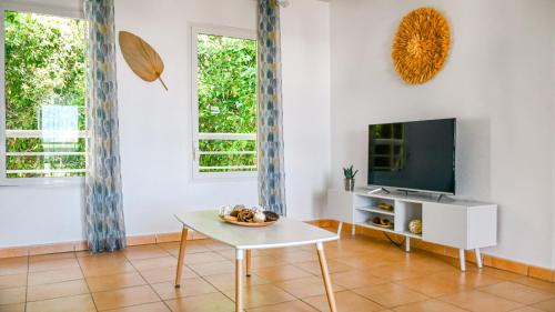 Μια τηλεόραση ή/και κέντρο ψυχαγωγίας στο Charmant appartement aux abymes
