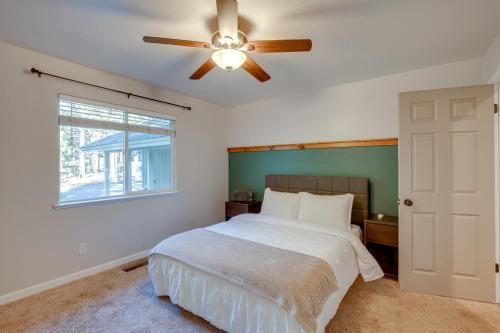 a bedroom with a bed and a ceiling fan at Cozy Lake Tahoe Home with Yard, Near Ski Resorts! in South Lake Tahoe
