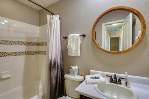 a bathroom with a sink and a toilet and a mirror at Ski-In Retreat with Pool Access 2 Blocks to Main St in Breckenridge