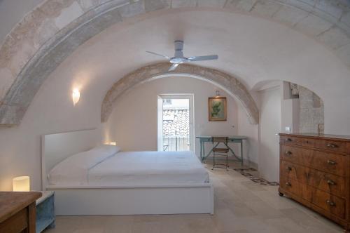 Posteľ alebo postele v izbe v ubytovaní Palazzo Degli Olivi