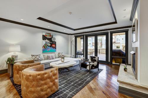 a living room with a couch and a table at Luxury 3 Bedroom Condo at The Arrabelle condo in Vail