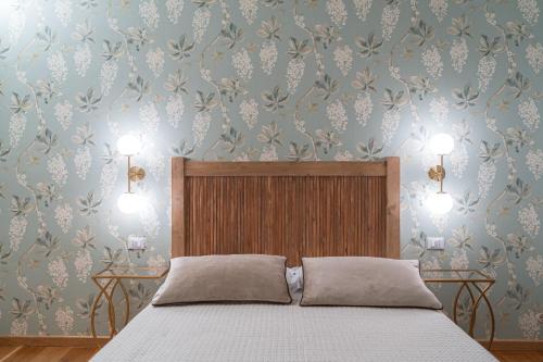 Postel nebo postele na pokoji v ubytování Acqua di Civita Beauty & Rooms IL PONTE