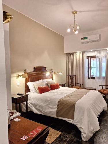 Giường trong phòng chung tại Posada del Cerro
