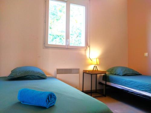 Легло или легла в стая в Le Clos Andrée - Charmante maison - Zone Nord Montauban - 8 couchages - 3 chambres - Jardin - Parking 3 véhicules - Garage - Climatisation