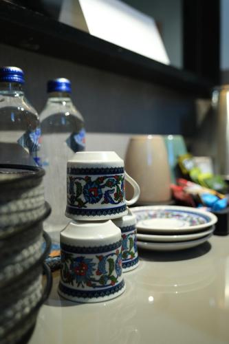 a group of blue and white cups sitting on a counter at Premium Dem Hotel - Istanbul Airport in Arnavutköy