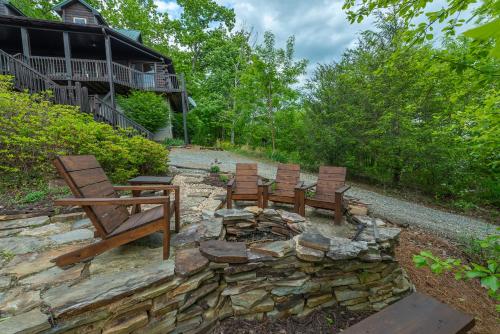 a group of wooden benches sitting on a stone wall at Summit Sunsets Pets & Year-Round Mountain Views! in Marion