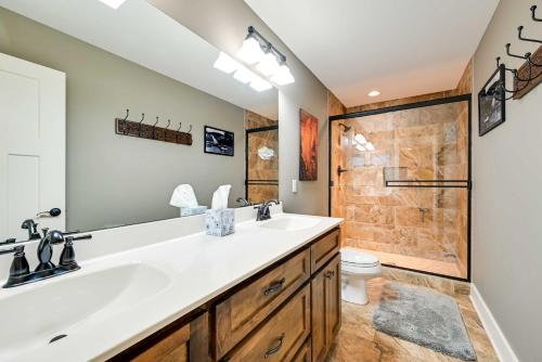 a bathroom with a sink and a shower at Nolin Lake Home with Hot Tub 15 Mi to Mammoth Cave! in Cub Run