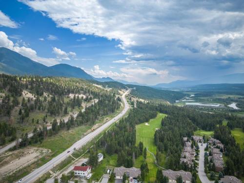 an aerial view of a road in the mountains at Serene Peaks, Private Hot Tub, Peaceful in Radium Hot Springs