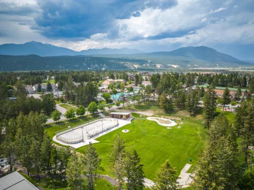 an aerial view of a park with mountains in the background at Serene Peaks, Private Hot Tub, Peaceful in Radium Hot Springs