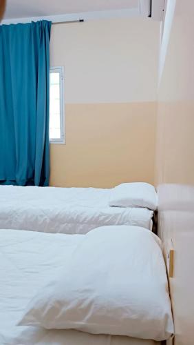 מיטה או מיטות בחדר ב-M&M للشقق الفندقية