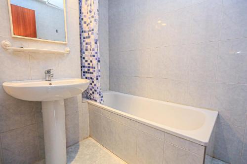 a bathroom with a sink and a bath tub at La Riviera Litoral - ONLY FAMILIES in Miami Platja