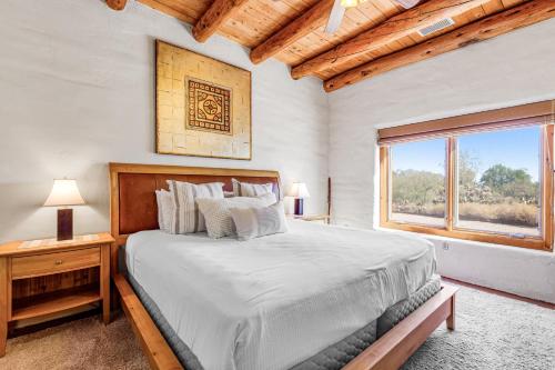 a bedroom with a large bed and a window at The Desert Z Lounge in Tucson