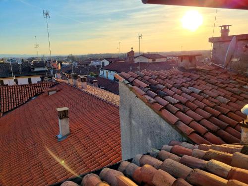 an overhead view of a roof with the sun setting at Le Stanze del Cardinale in Pavia