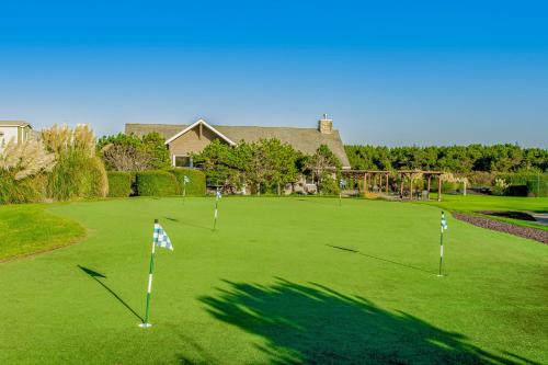 a golf course with flags on the green at Ocean Avenue Condos in Westport