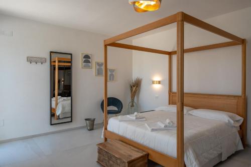 Postel nebo postele na pokoji v ubytování Murieri Rooms