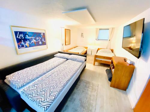 Postel nebo postele na pokoji v ubytování Practical Loft Comfort near Munich