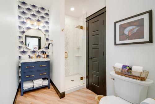 a bathroom with a blue cabinet and a mirror at Idyllic Biggsville Vacation Rental 10 Mi to River in Biggsville