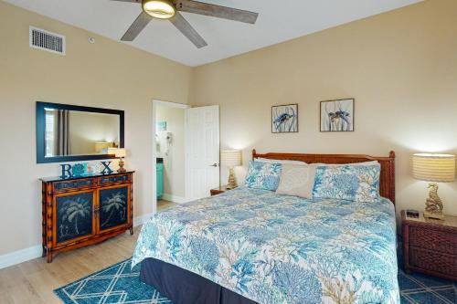 a bedroom with a bed and a ceiling fan at Madeira Bay Resort 509 in St. Pete Beach