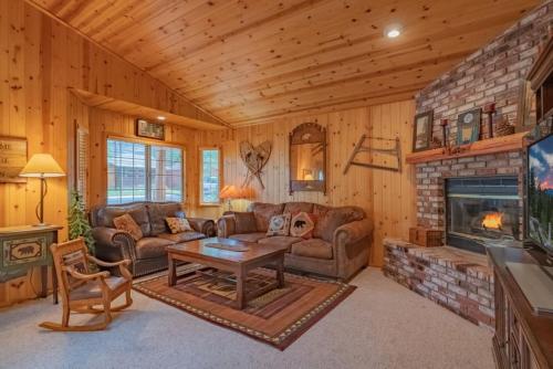 a living room with a couch and a fireplace at Willow Bear near Big Bear Alpine Zoo and Golf Course in Big Bear Lake
