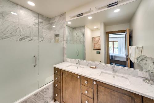 a bathroom with two sinks and a shower at Sun Valley Condo with Furnished Patio Near Skiing! in Sun Valley