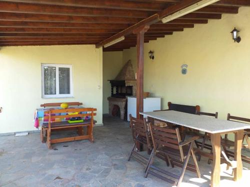a dining room with a table and chairs at Luxury Villa Ntina in Maronia