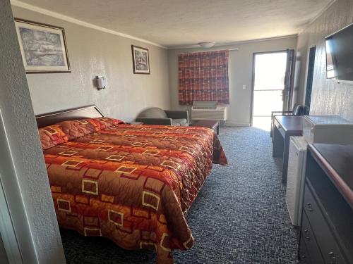 Postel nebo postele na pokoji v ubytování Hotel 81 El Reno
