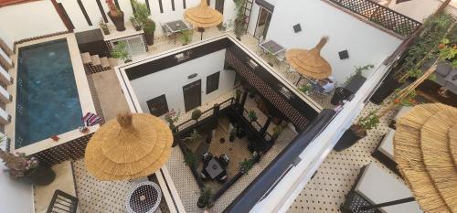 an overhead view of a house with a swimming pool at Dar Najat in Marrakech