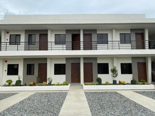 a building with a balcony on top of it at Eden’s Residence Space Rental in Cagayan de Oro
