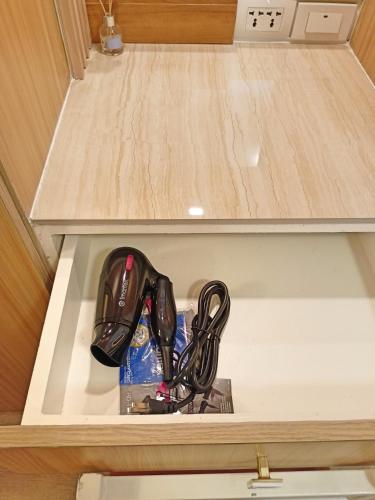 a controllers in a drawer in a room at Donser Studio in Bacolod