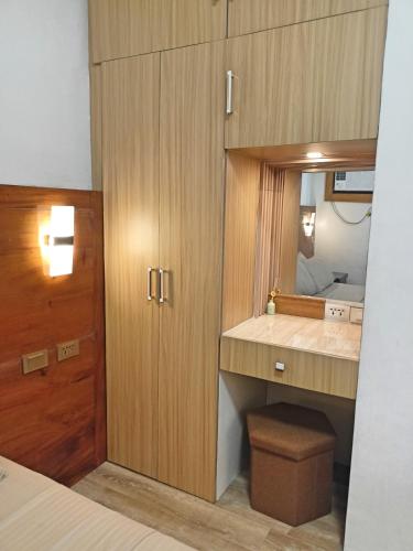 a small bathroom with a sink and a mirror at Donser Studio in Bacolod