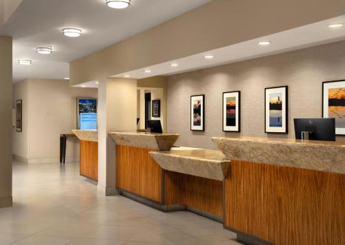 a lobby with marble counter tops in a hotel at Hilton Stockton in Stockton