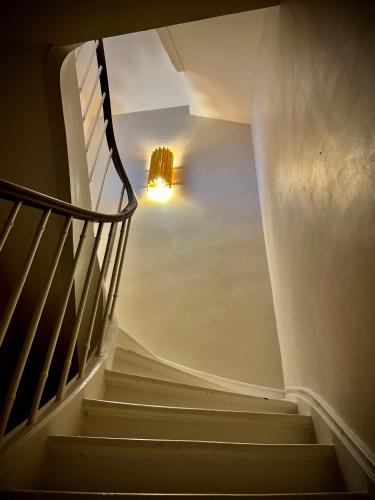 a stairway with a light at the top at Richard Lequet Domaine gastronomique du Val d Atur in Boulazac