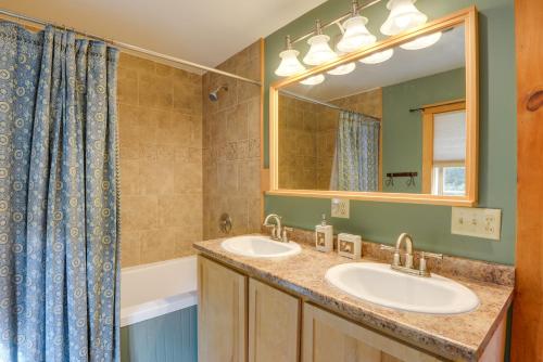 a bathroom with two sinks and a mirror at Charming Putney Home Porch, Grill and Hiking Trails in Putney