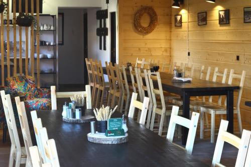 a dining room with a black table and chairs at Apartmany Kadleců in Volary