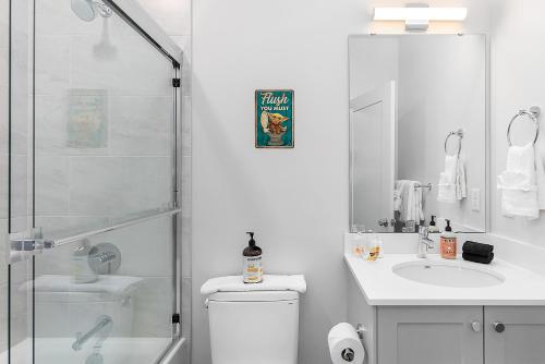 a bathroom with a shower and a toilet and a sink at Palpatine Sith Lord Suite in Seattle