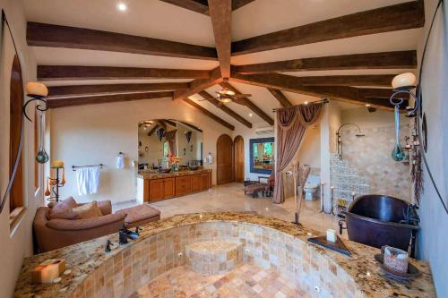 a large kitchen with a large tub in a room at Sea Treasure Villa in Puerto Vallarta