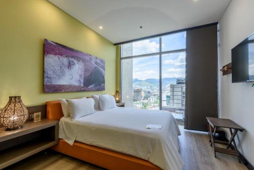 Postel nebo postele na pokoji v ubytování Diez Hotel Categoría Colombia