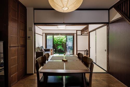a dining room with a long table and chairs at Sennichi House - Vacation STAY 20290v in Kanazawa