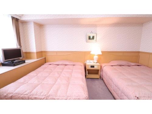 Voodi või voodid majutusasutuse Hotel Montagne Matsumoto - Vacation STAY 82932v toas