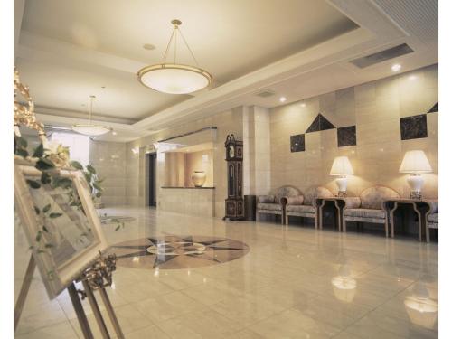 a lobby with couches and a glass table at Hotel Montagne Matsumoto - Vacation STAY 82925v in Matsumoto