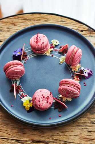 a plate of pink ice cream on a table at King Street Townhouse in Manchester