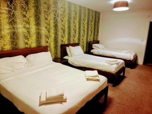 A bed or beds in a room at The Gillygate Bar and Rooms