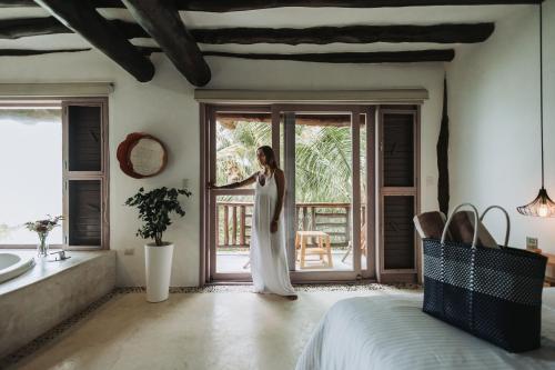 Ein Bett oder Betten in einem Zimmer der Unterkunft Las Nubes de Holbox