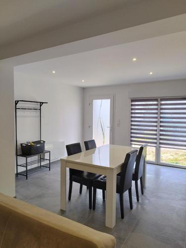 a dining room with a table and chairs at Gîte l'harmonie I in Fraize