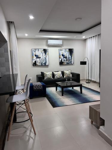 a living room with a couch and a table at Kaya Apartments 2 in Lusaka