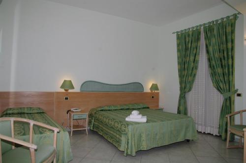 Кровать или кровати в номере Hotel Villa Belvedere