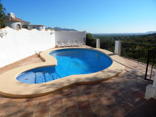 a swimming pool on top of a house at Villa Paloma in Orba