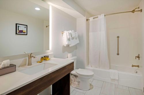 a bathroom with a sink and a toilet and a shower at Best Western Plus Harrisonburg in Harrisonburg